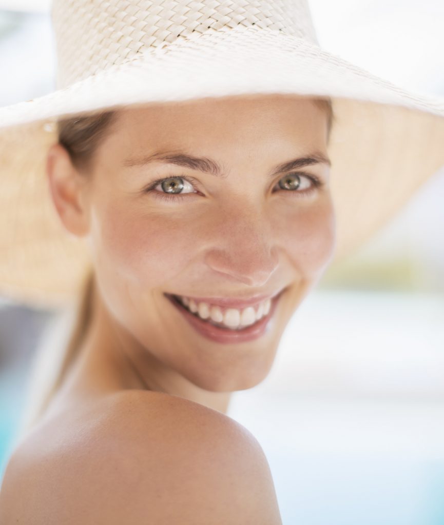 Smiling woman in a sun hat